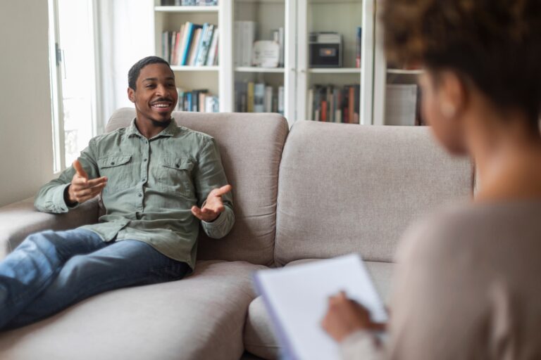 Inspired,Thrilled,Handsome,Young,Black,Man,In,Casual,Reclining,On