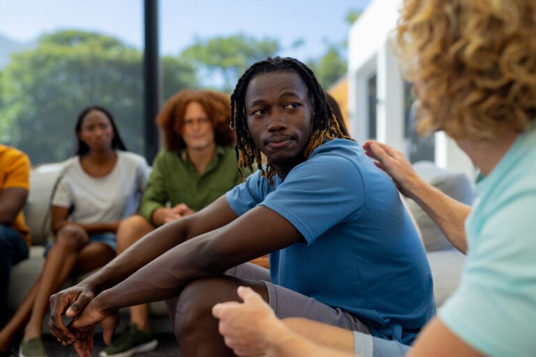 Group,Of,Diverse,People,Sitting,On,Sofa,And,Talking,In