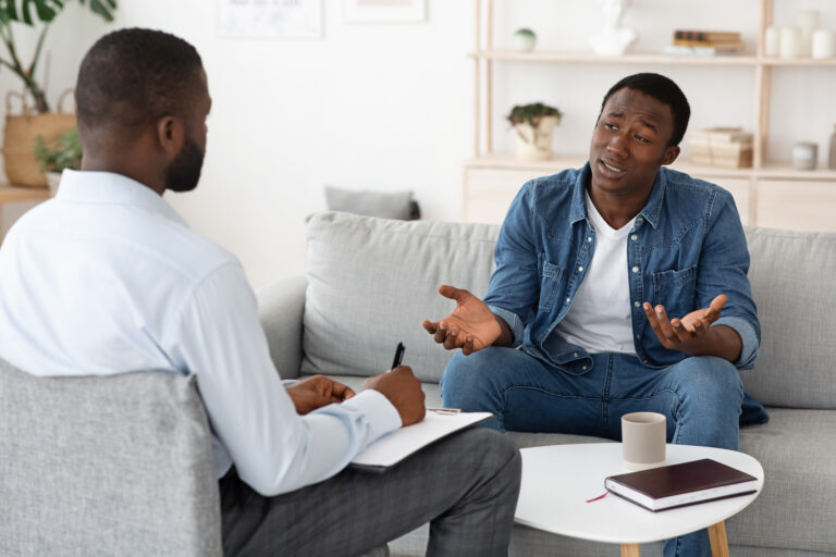 Stressed,Black,Man,Explaining,His,Problems,To,Psychologist,At,Individual