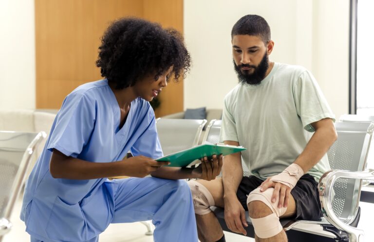 African,Black,Nurse,Woman,Asking,Injured,Informations,From,Young,Caucasian